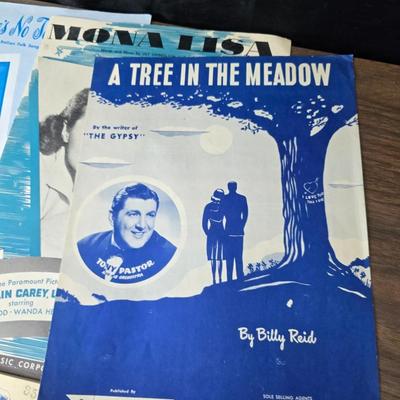 Super stamp collection booklets, Kenny Rogers pamphlet, Small historical booklets, books, and some sheets of music