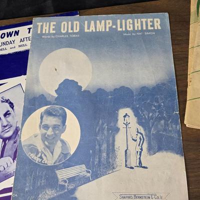 Super stamp collection booklets, Kenny Rogers pamphlet, Small historical booklets, books, and some sheets of music