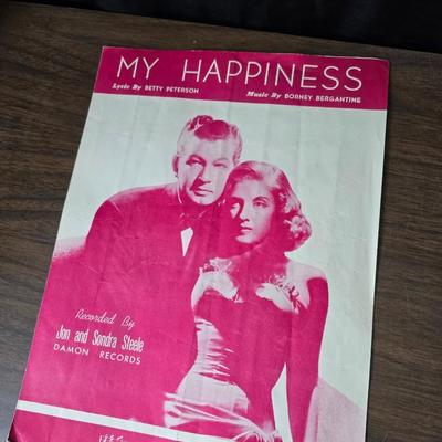 Super stamp collection booklets, Kenny Rogers pamphlet, Small historical booklets, books, and some sheets of music