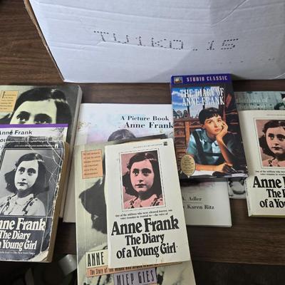 Boxes of softback books of different genres - Anne Frank - and more