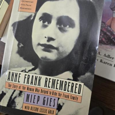 Boxes of softback books of different genres - Anne Frank - and more