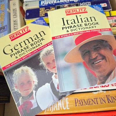 Boxes of softback books of different genres - Anne Frank - and more