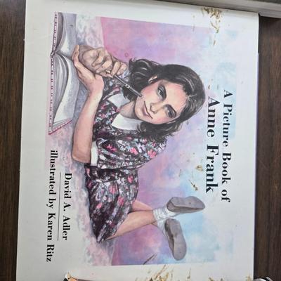 Boxes of softback books of different genres - Anne Frank - and more