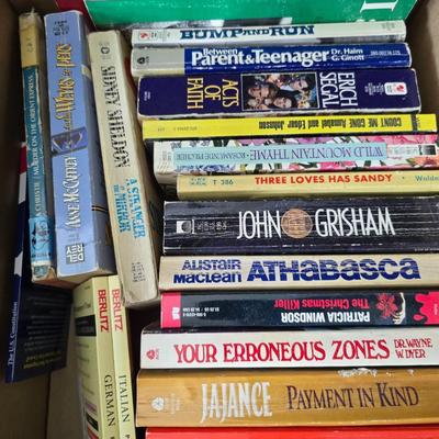 Boxes of softback books of different genres - Anne Frank - and more
