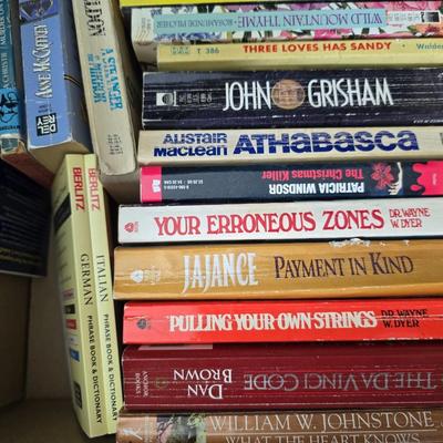 Boxes of softback books of different genres - Anne Frank - and more