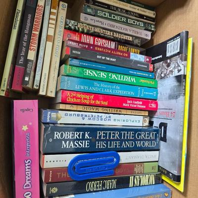 Boxes of softback books of different genres - Anne Frank - and more