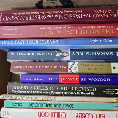 Boxes of softback books of different genres - Anne Frank - and more