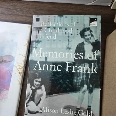 Boxes of softback books of different genres - Anne Frank - and more