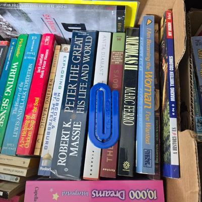 Boxes of softback books of different genres - Anne Frank - and more