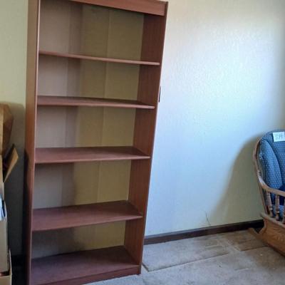 Tall wood bookshelf with adjustable shelves