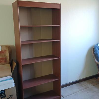 Tall wood bookshelf with adjustable shelves