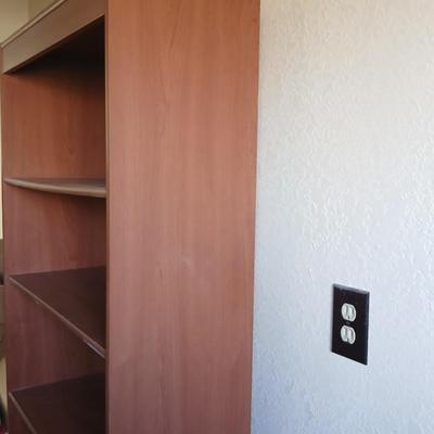 Tall wood bookshelf with adjustable shelves