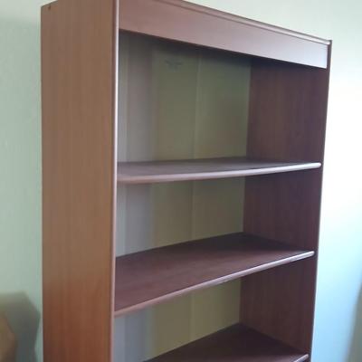 Tall wood bookshelf with adjustable shelves