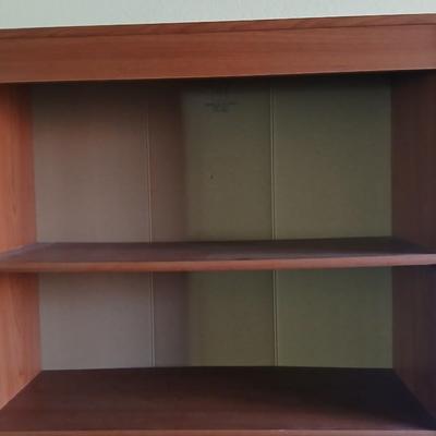 Tall wood bookshelf with adjustable shelves