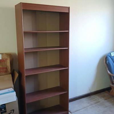 Tall wood bookshelf with adjustable shelves