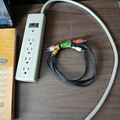 Coax cable for the TV, HDMI Cable Television antenna a powerstrip surge protector and other assorted TV cables