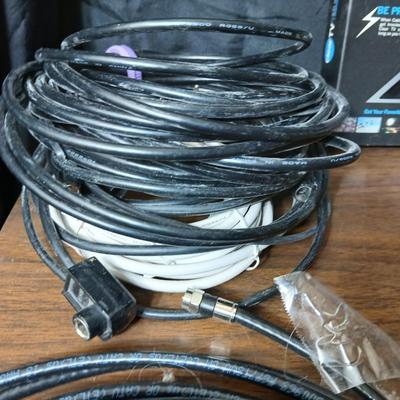 Coax cable for the TV, HDMI Cable Television antenna a powerstrip surge protector and other assorted TV cables