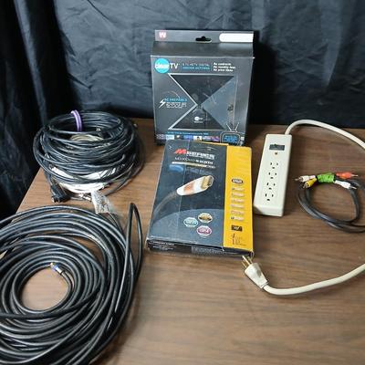 Coax cable for the TV, HDMI Cable Television antenna a powerstrip surge protector and other assorted TV cables