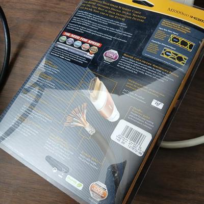 Coax cable for the TV, HDMI Cable Television antenna a powerstrip surge protector and other assorted TV cables