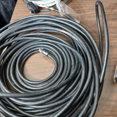 Coax cable for the TV, HDMI Cable Television antenna a powerstrip surge protector and other assorted TV cables