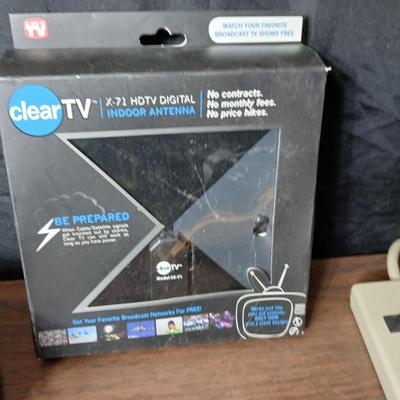 Coax cable for the TV, HDMI Cable Television antenna a powerstrip surge protector and other assorted TV cables