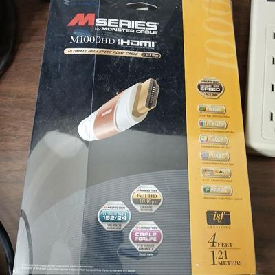 Coax cable for the TV, HDMI Cable Television antenna a powerstrip surge protector and other assorted TV cables