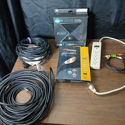 Coax cable for the TV, HDMI Cable Television antenna a powerstrip surge protector and other assorted TV cables