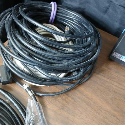 Coax cable for the TV, HDMI Cable Television antenna a powerstrip surge protector and other assorted TV cables