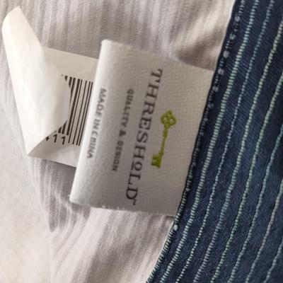 Assortment of curtains and throw rugs