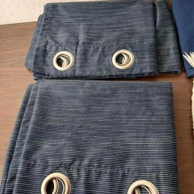 Assortment of curtains and throw rugs