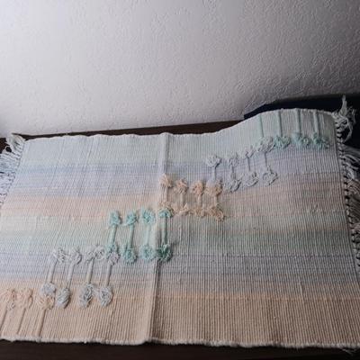 Assortment of curtains and throw rugs