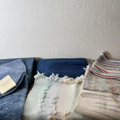 Assortment of curtains and throw rugs