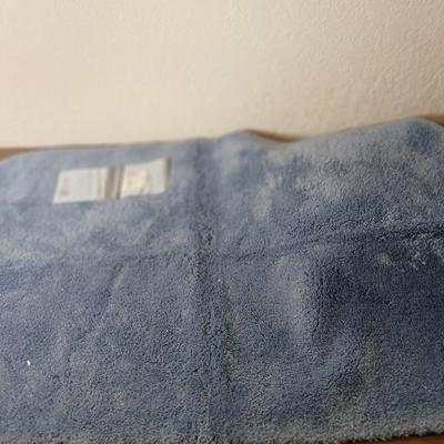 Assortment of curtains and throw rugs