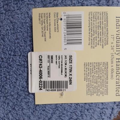 Assortment of curtains and throw rugs