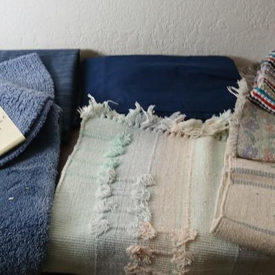 Assortment of curtains and throw rugs