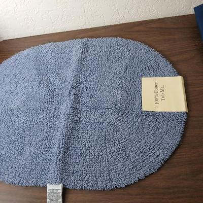 Assortment of curtains and throw rugs