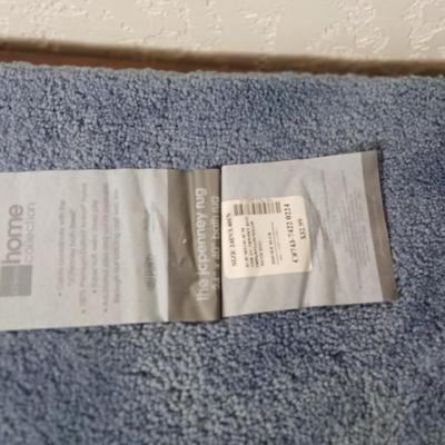 Assortment of curtains and throw rugs