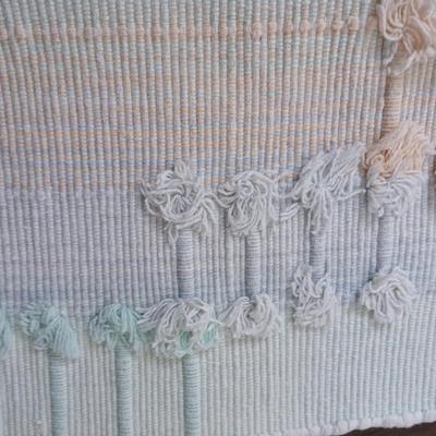 Assortment of curtains and throw rugs