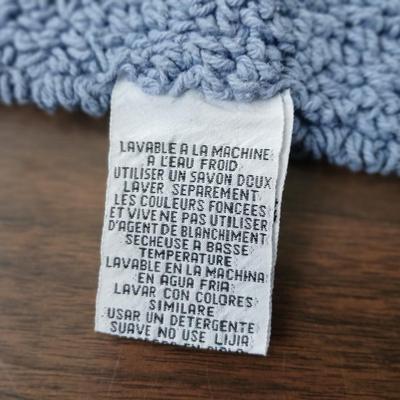 Assortment of curtains and throw rugs