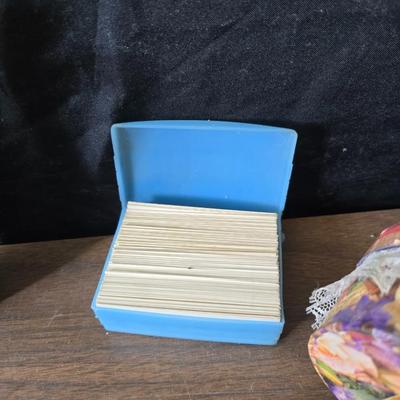 Assortment of collectibles - vintage guitar strings - vintage lighter - trinket boxes - vintage vase - brand new smart bracelet and more
