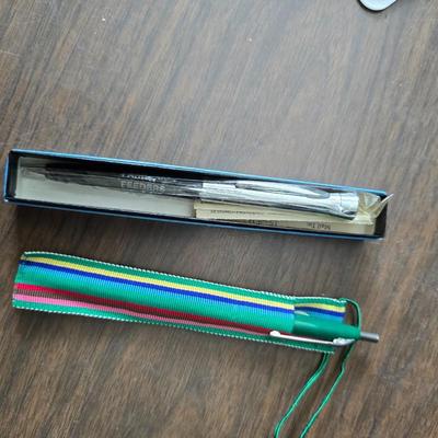 Assortment of collectibles - vintage guitar strings - vintage lighter - trinket boxes - vintage vase - brand new smart bracelet and more