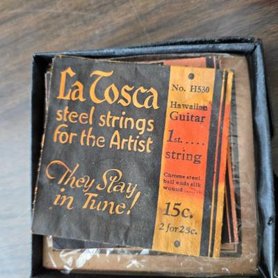 Assortment of collectibles - vintage guitar strings - vintage lighter - trinket boxes - vintage vase - brand new smart bracelet and more