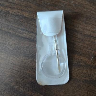 Assortment of collectibles - vintage guitar strings - vintage lighter - trinket boxes - vintage vase - brand new smart bracelet and more