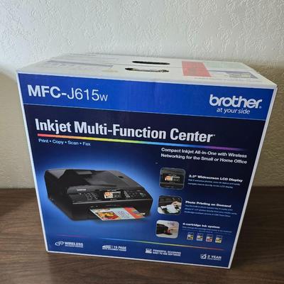Brother Inkjet multi-function center / printer and a paper shredder with an assortment of alarm clocks