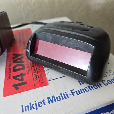Brother Inkjet multi-function center / printer and a paper shredder with an assortment of alarm clocks