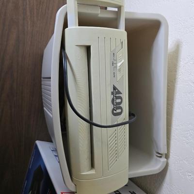 Brother Inkjet multi-function center / printer and a paper shredder with an assortment of alarm clocks