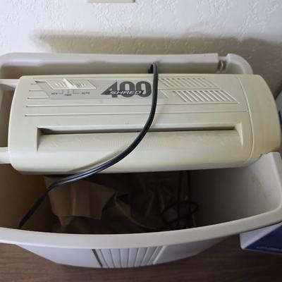 Brother Inkjet multi-function center / printer and a paper shredder with an assortment of alarm clocks