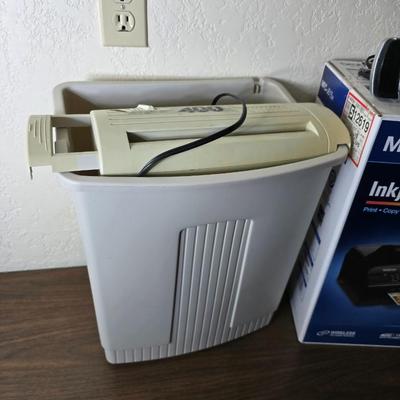 Brother Inkjet multi-function center / printer and a paper shredder with an assortment of alarm clocks