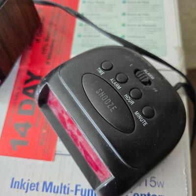 Brother Inkjet multi-function center / printer and a paper shredder with an assortment of alarm clocks