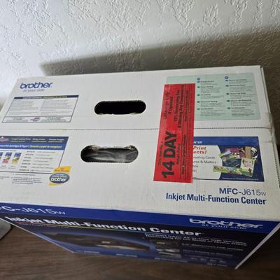 Brother Inkjet multi-function center / printer and a paper shredder with an assortment of alarm clocks